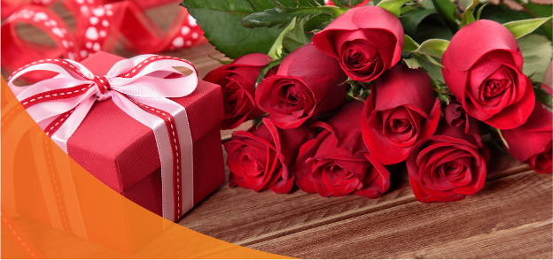 Valentine’s Day Flowers - Red Roses and a Red Gift Box With a Pink Ribbon
